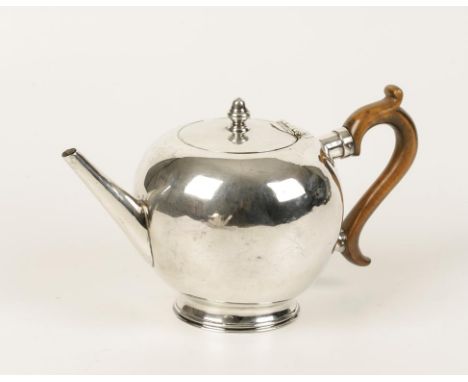 A GEORGE I SCOTTISH BULLET TEAPOT, the flush hinged cover with acorn finial, wooden scroll handle and straight spout, makers 