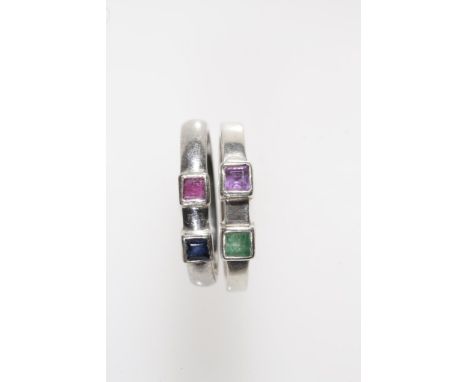 A MODERN PLATINUM BAND, collet-set individually to the top with a princess-cut sapphire and princess-cut ruby, Birmingham 200