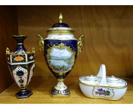 A Coalport Keith Hancock vase and cover "Windermere", the painted lake scene within deep blue and gilt-decorated body and ram