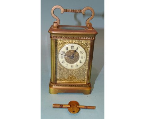 A late-19th century French carriage timepiece, the foliate gilt dial with white chapter ring, 15cm, including handle, (Swiss 