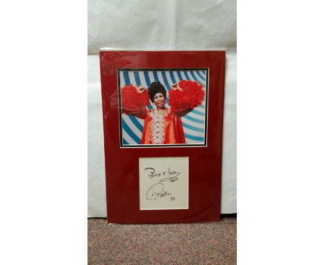 POP MUSIC, signed large blank page by Aretha Franklin (first name only), 1999, overmounted beneath colour photo of her in con