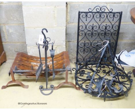   A cast and wrought iron fire grate, spark guard, fire implements, a light fitting and wall lights.