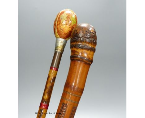   A Japanese carved bamboo walking stick and a Persian polychrome painted walking cane, tallest 97cm