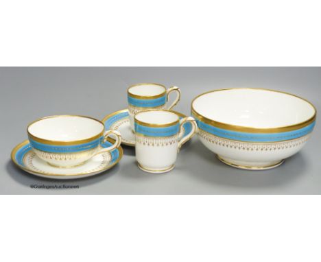   A Minton coffee cup, teacup and saucer with turquoise and gold jewelled band under a gold acid etched border, a matching co