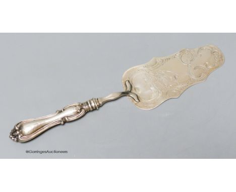   A Swedish white metal cake slice, engraved with hunting scene, 27cm.