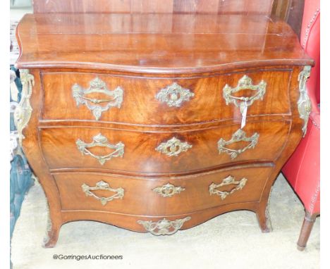   A 19th century Dutch gilt metal mounted mahogany bombe commode. W-110, D-55, H-83cm.