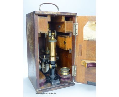   A lacquered brass microscope with lenses by E. Leitz, boxed