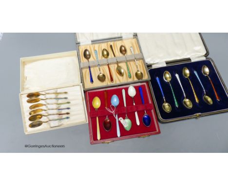  Four assorted cased sets of 6 sterling and enamel coffee spoons.