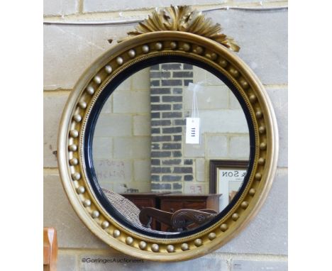   A Victorian gilt circular mirror. D-62cm.