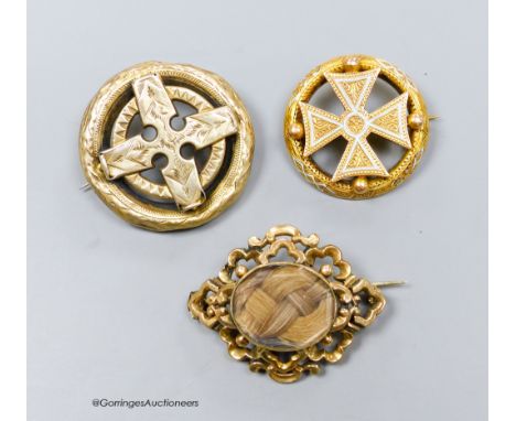   A Victorian yellow metal and enamel brooch, with central cross motif, 31mm and two other brooches including mourning.