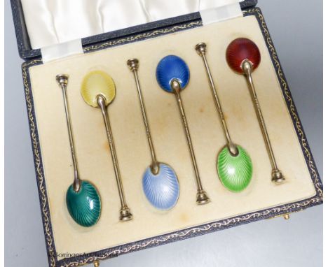   A cased set of six silver gilt and enamel coffee spoons, Birmingham, 1954.