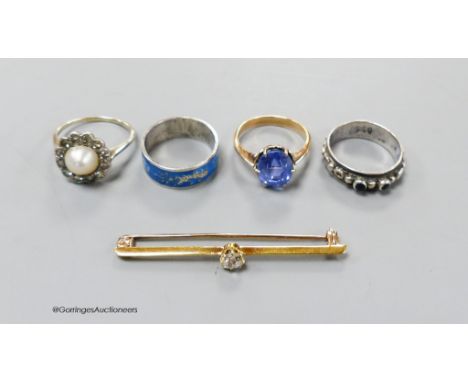   A yellow metal, split pearl and diamond set cluster ring, size K/L, an oval sapphire ring, size H, a yellow metal and diamo
