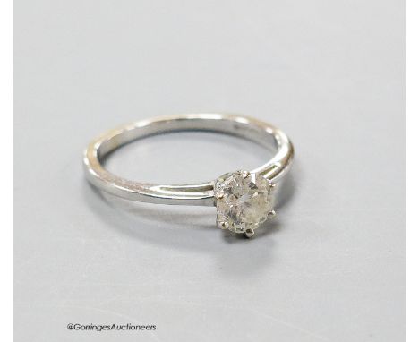   An 18ct white gold and solitaire diamond ring, size K/L, gross 2.2 grams.