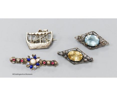   Two gem-set silver openwork lozenge-shaped brooches (possibly Scandinavian), a silver brooch in the form of a longship and 