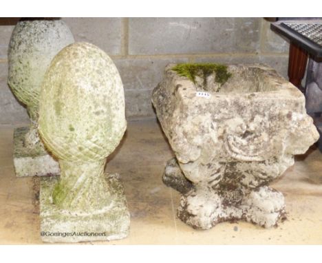   A pair of reconstituted stone acorn finials. H-42cm. Together with a stone garden planter.