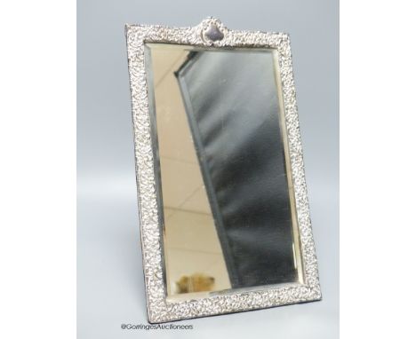   An Edwardian repousse silver mounted rectangular easel mirror, Deakin &amp; Francis, Birmingham, 1904, 32.7cm.