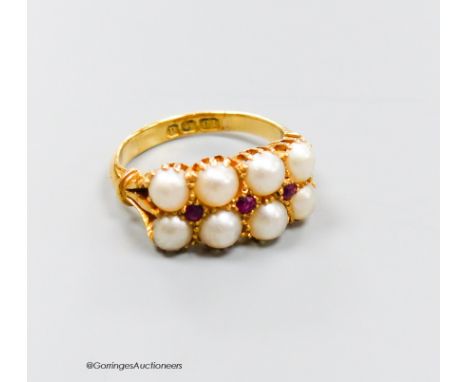   An 18ct gold split pearl and ruby cluster ring, size J/K, gross 5.3 grams.