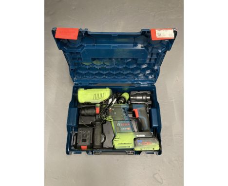 A Bosch professional 8 volt cordless rotary hammer drill in box.