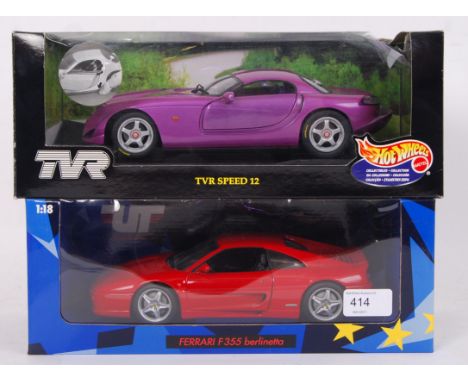 Two 1:18 precision diecast model cars. The first a Hotwheels Collectibles 1:18 sclae TVR Speed 12 in purple, the other being 