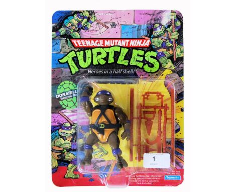 An original vintage Playmates Teenage Mutant Ninja / Hero Turtles carded 10 back action figure of Donatello. The figure still