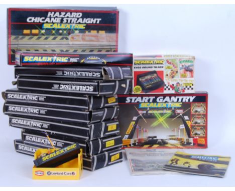 A large collection of assorted vintage Scalextric track accessories to include; C223 Hazard Chicane Straight, C700 Dunlop Bri