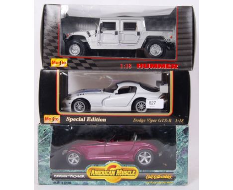 A collection of 3x 1:18 scale boxed diecast model cars - A Maisto Hummer, Maisto Dodge Viper and an ERTL American Muscle Plym