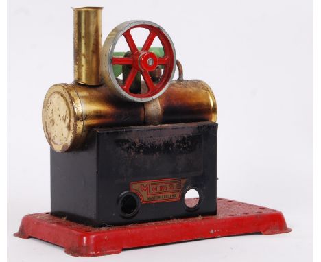 A vintage Mamod Live Steam plant. Single boiler and piston arrangement, on a red metal base. Compete with burner. 17cm tall.&