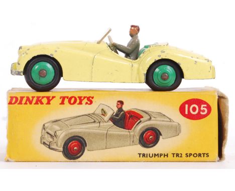 An original vintage Dinky Toys diecast model 105 Triumph TR2 Sports. Within the original box. Yellow body, green interior and