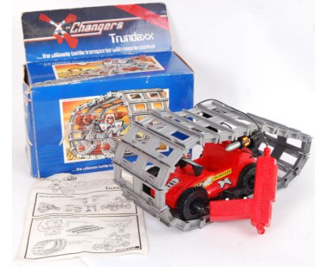 A rare vintage Acamas Toys made ' X - Changers ' toy Trundaxx vehicle. Within the original box, complete with instructions. '