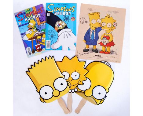 A collection of Simpsons memorabilia to include 3x San Diego Comic Con promotional hand fans, a magazine advert page signed b
