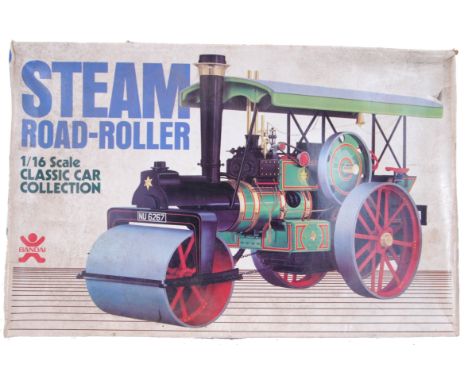 A rare vintage Bandai made 1:16 scale ' Steam Road Roller ' model kit. Appears to be unused, with contents still sealed in ba