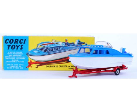 An original vintage Corgi Toys diecast model No. 104 Dolphin 20 Cruiser on Wincheon Trailer. Diecast trailer with plastic mod