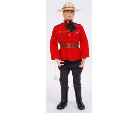An original vintage Palitoy made ' Canadian Mountie ' Action Man figure. Appears complete, with hat and binoculars etcNote: F