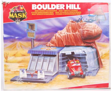 An original vintage 1980's Kenner made MASK action figure playset ' Boulder Hill .' Within a good original box. Largely compl