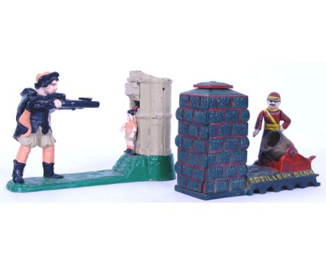 Two antique style reproduction cast iron painted money boxes. The first an 'Artillery Bank,' the other a shooting range. Both