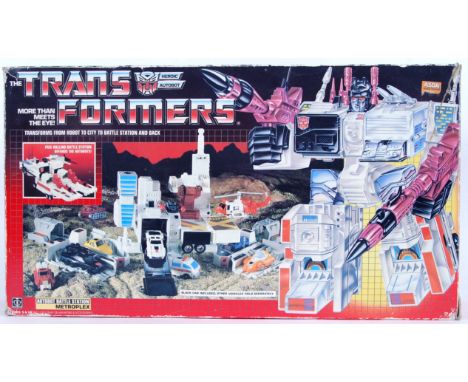 An original vintage 1980's Hasbro made G1 Transformers toy 'Metroplex .' Appears to be complete (but unchecked) with instruct