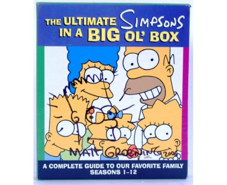 An original ' Ultimate Simpsons In A Big Ol' Box ' book collection. Signed to the front by creator Matt Groening who has adde