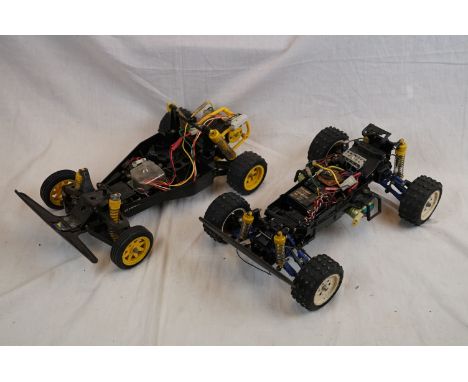 A 2WD electric hyper off road racer buggy 1/10 vintage chassis only together with 4WD vintage electric 1/10 buggy chassis wit