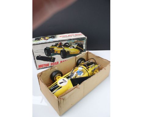 Boxed Battery Operated r/c Motor Roar Racer plastic car, in yellow, with driver, gd overall, box fair 