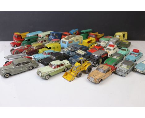 Around 34 mid 20th C play worn mainly Corgi, with Matchbox, Solido &amp; Dinky diecast models to include Corgi Lucozade Karri