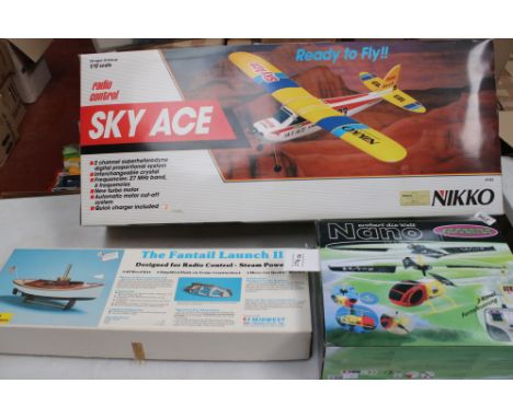 A Nikko radio controlled Sky Ace 1/12 scale model aircraft together with a Nano remote control helicopter and a The Fantail L