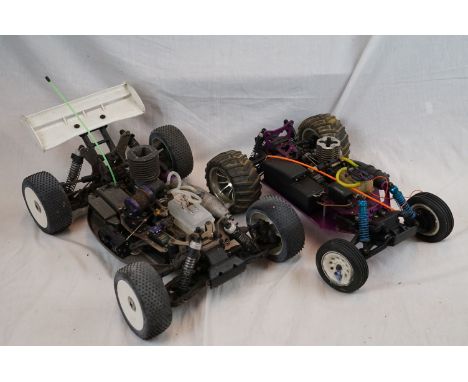 A Hobao Hyper 7 1/8 scale RTR buggy 4WD together with a CEN Racing 1/10 nitro stadium truck 2WD. 