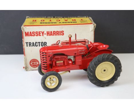 Boxed Lesney Products Scale Model Massey Harris Tractor in red with cream hubs, diecast vg, tatty box 