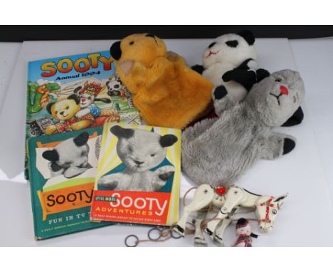 Group of Sooty related puppets and books to include vintage Sooty, Sweep &amp; Soo, 3 x books and a Muffin the Mule metal pup