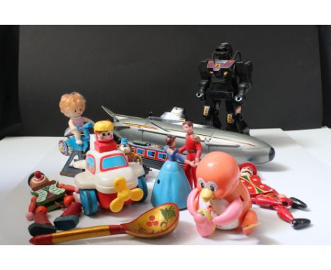 Group of mixed toys to include wooden puppets, plastic robot, plastic submarine etc 