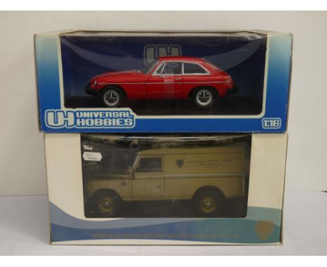 A 1:18 scale universal hobbies diecast MGB GT-Mk.II together with a 1:18 scale limited edition Heritage Millennium Land Rover