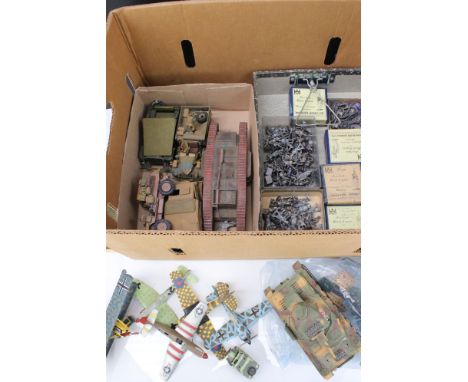 A collection of miniature metal unpainted military figures together with a selection of military model vehicles to include ta