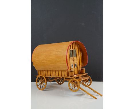 A scratch built model of a Romany caravan built from matches and dowling. Measures approx 44cm in length. 
