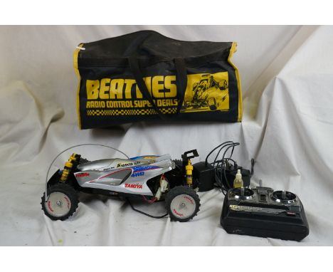A Tamiya Manta Ray 1/10 scale electric buggy 4WD (58087) with battery, chargers and controller. 