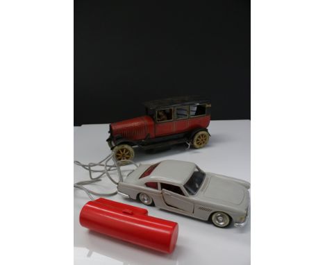 Early - mid 20th C tin plate wind up model car by JDN of Germany, showing wear and repair plus a plastic W Toys  (Hong Kong) 